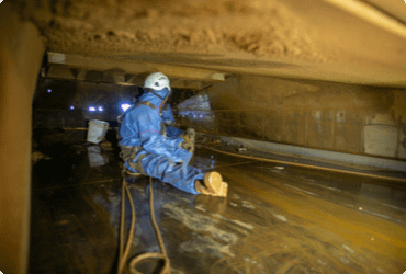 A trapped worker waits to be rescued from a confined space