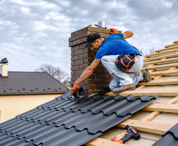 A roofer uses working at heights best practices while putting down shingles
