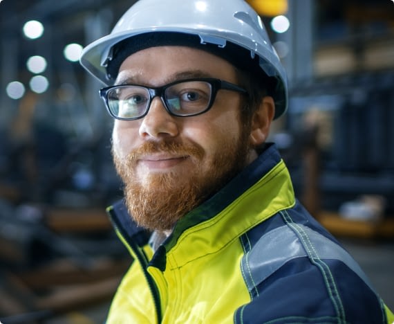 A member of a joint health and safety committee smiles at the camera